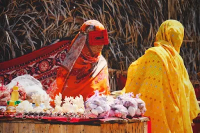 Local women of Hengam Island wearing colorful scarfs.