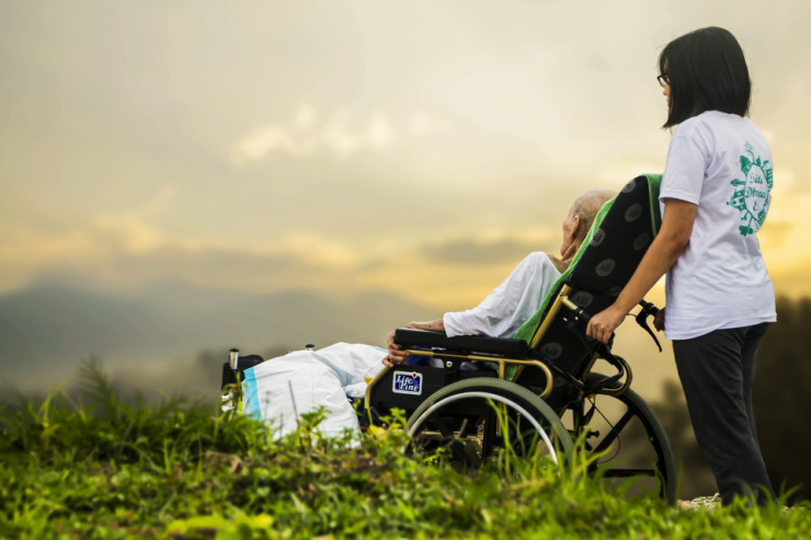 caregiver and woman in wheelchair