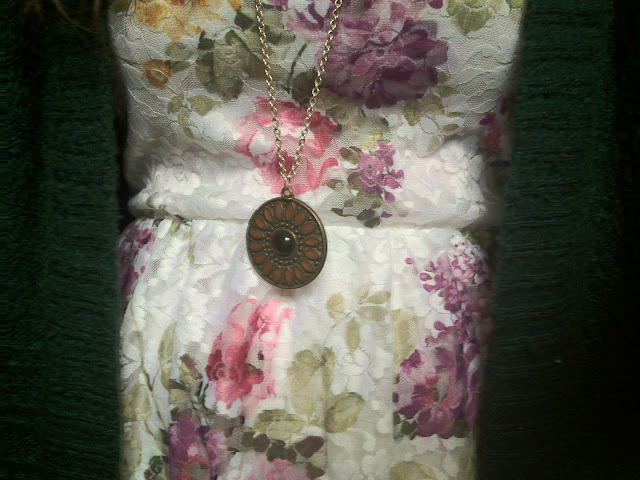 Floral dress with a pendant necklace