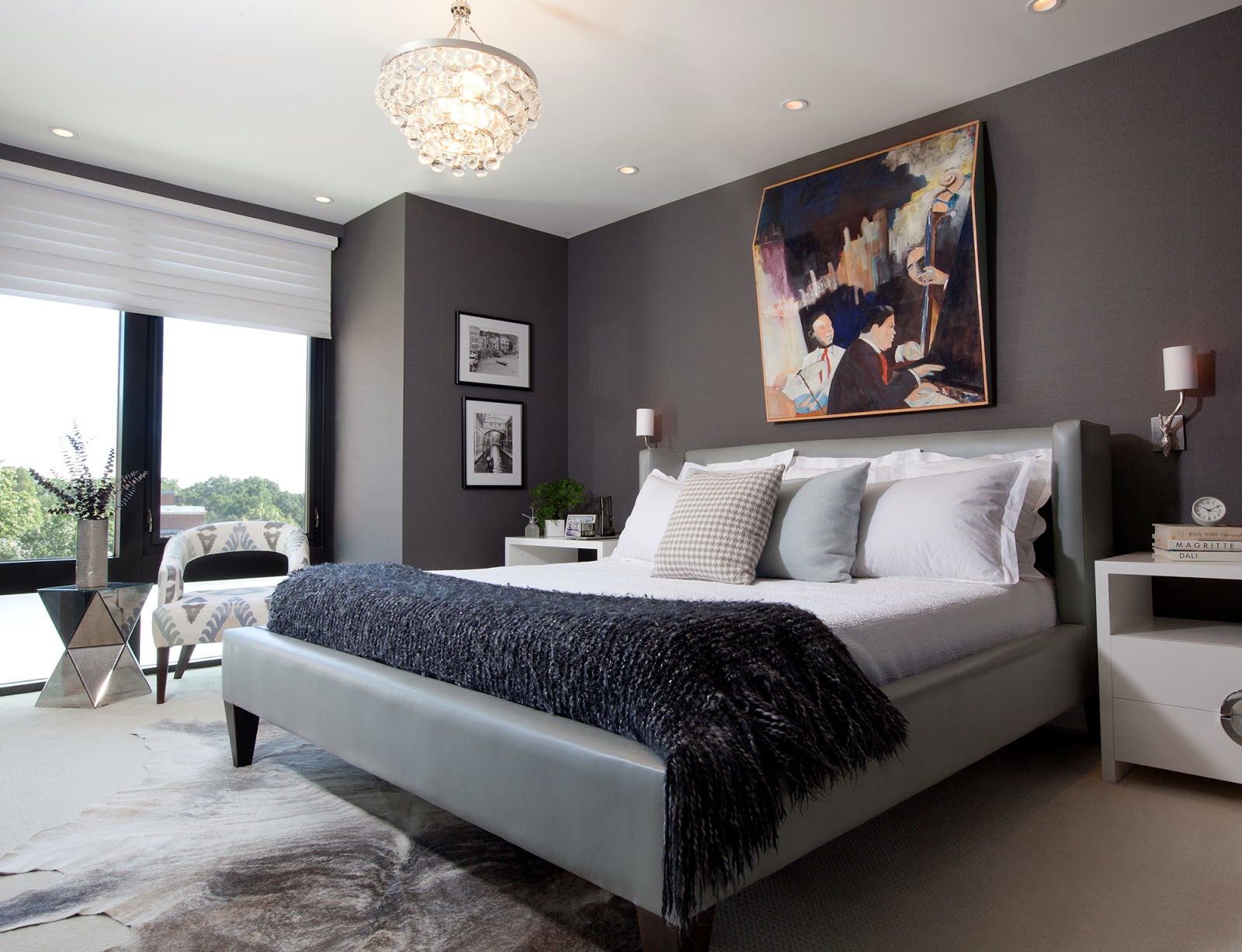 sleek modern master bedroom with charcoal gray wallpaper, a leather ...