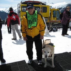 Jim and yellow Lab Atticus at ski resort