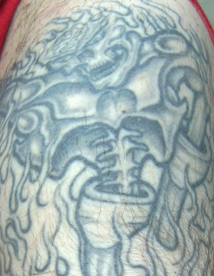 This segment of the tattoo seems inspired by Iron Maiden's album cover 