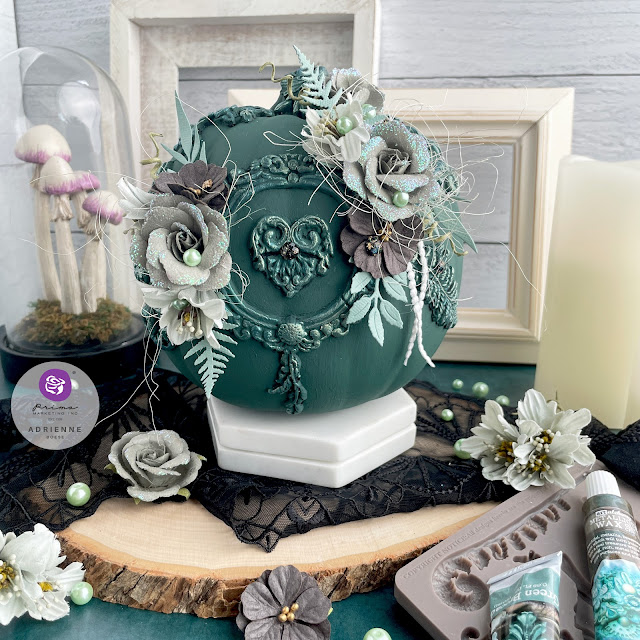 Dark green altered pumpkin with a dark academia aesthetic using moulds, flowers, pearls and gems from Prima Marketing Inc. (Lost in Wonderland, Twilight and The Plant Department Collections); Frank Garcia Memory Hardware; and Finnabair moulds, paint and wax.