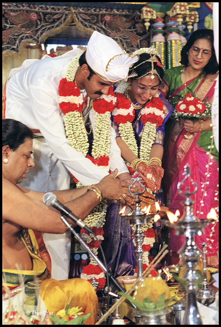 In a Sri Lankan Tamil wedding ceremony the performance of symbolic and 