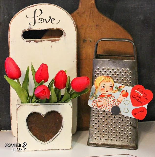 Photo of thrift shop items repurposed as Valentine's Day decor.