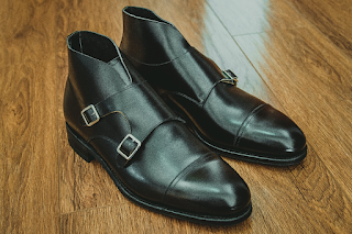 A Black Pair of Double Straps Monk Boots with Cap Toe