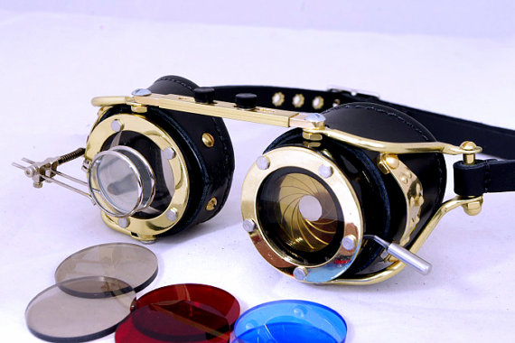 Steampunk goggles with magnifying lenses (dual magnifiers) and camera aperture shutter lens made of brass. Made of steel brass and leather