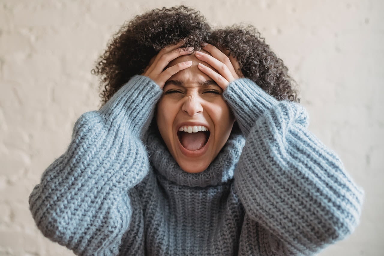 Curly hair woman screaming