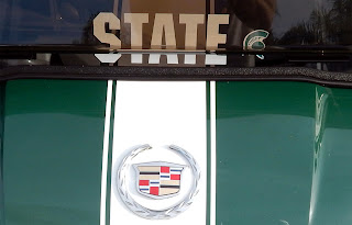 Cadillac emblem on customized Michigan State Spartan E-Z-GO golf cart, Sun City Center, FL 