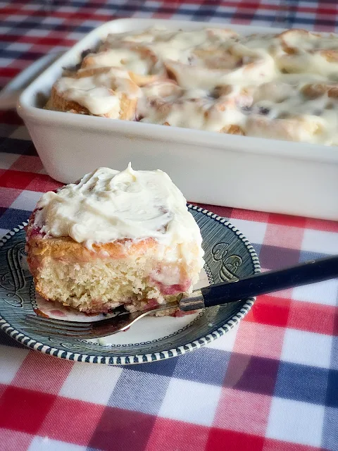 Fast Rise Blackberry Sweet Rolls, a soft, tender dough swirled with a mixture of vanilla brown sugar and butter and a generous layer of luscious, whole blackberries all throughout and topped with a cream cheese frosting.