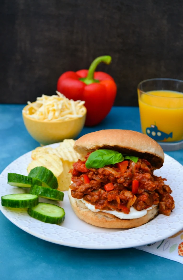 An easy recipe for vegan sloppy joes studded with red pepper and spiced up with paprika and cumin. Serve on a toasted bun with cream cheese and grated cheddar (vegan or veggie, it's up to you).