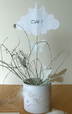 table number and centerpiece for white wedding