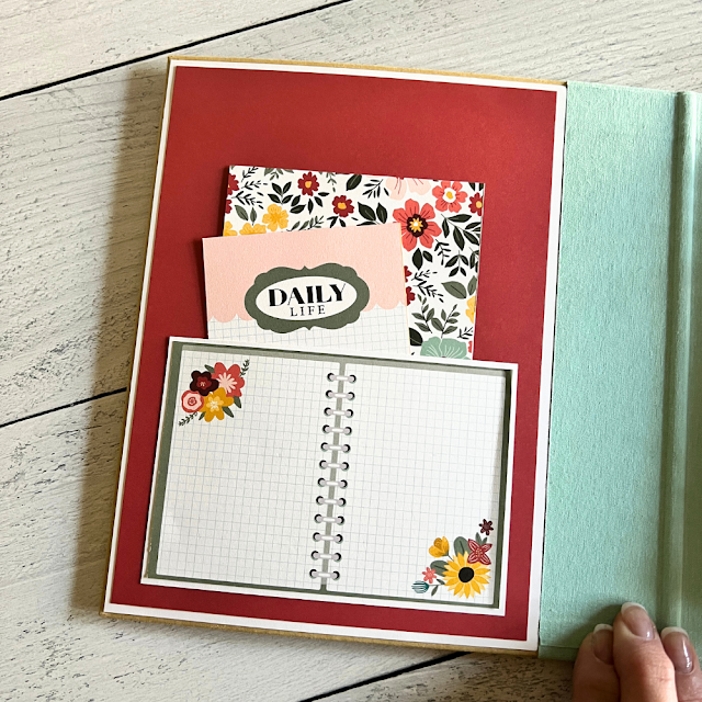 A Year in Review Scrapbook Album Page with a notebook, a pocket, and journaling cards