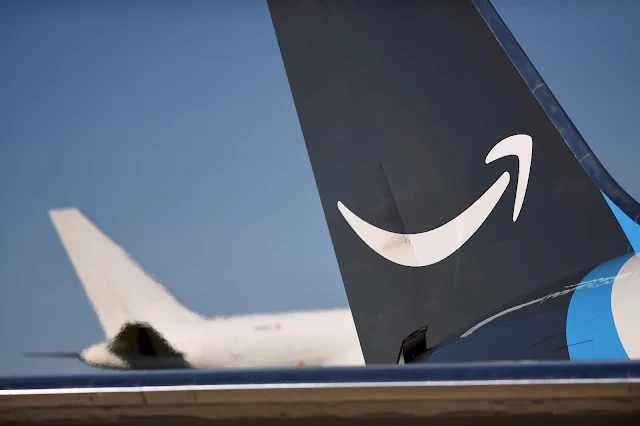  Image Attribute: A wide body aircraft emblazoned with Amazon's Prime logo is unloaded at Lehigh Valley International Airport in Allentown, Pennsylvania, U.S. December 20, 2016. Picture taken December 20, 2016.   REUTERS/Mark Makela