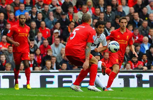 Manchester United defender Rafael shoots to score the equaliser against Liverpool