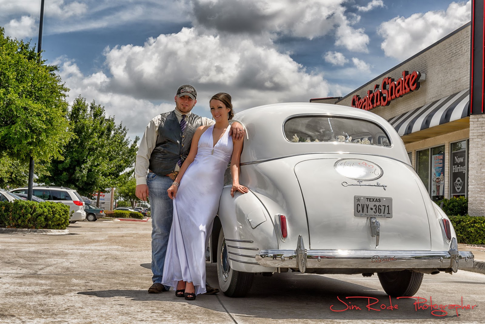 after the wedding portrait in the parking lot of Steak and Shake