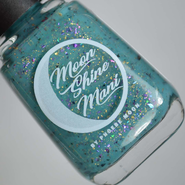 teal nail polish with flakies in a bottle