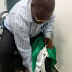 Former Plateau State Governor's media aide apologises for wiping his shoes with PDP flag 