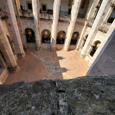 large skull drawn in white chalk on the stones of the courtyard of a 16th century convent