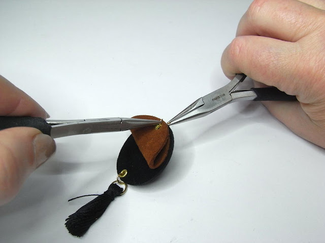 Closing the jump ring with two pairs of chain nose pliers