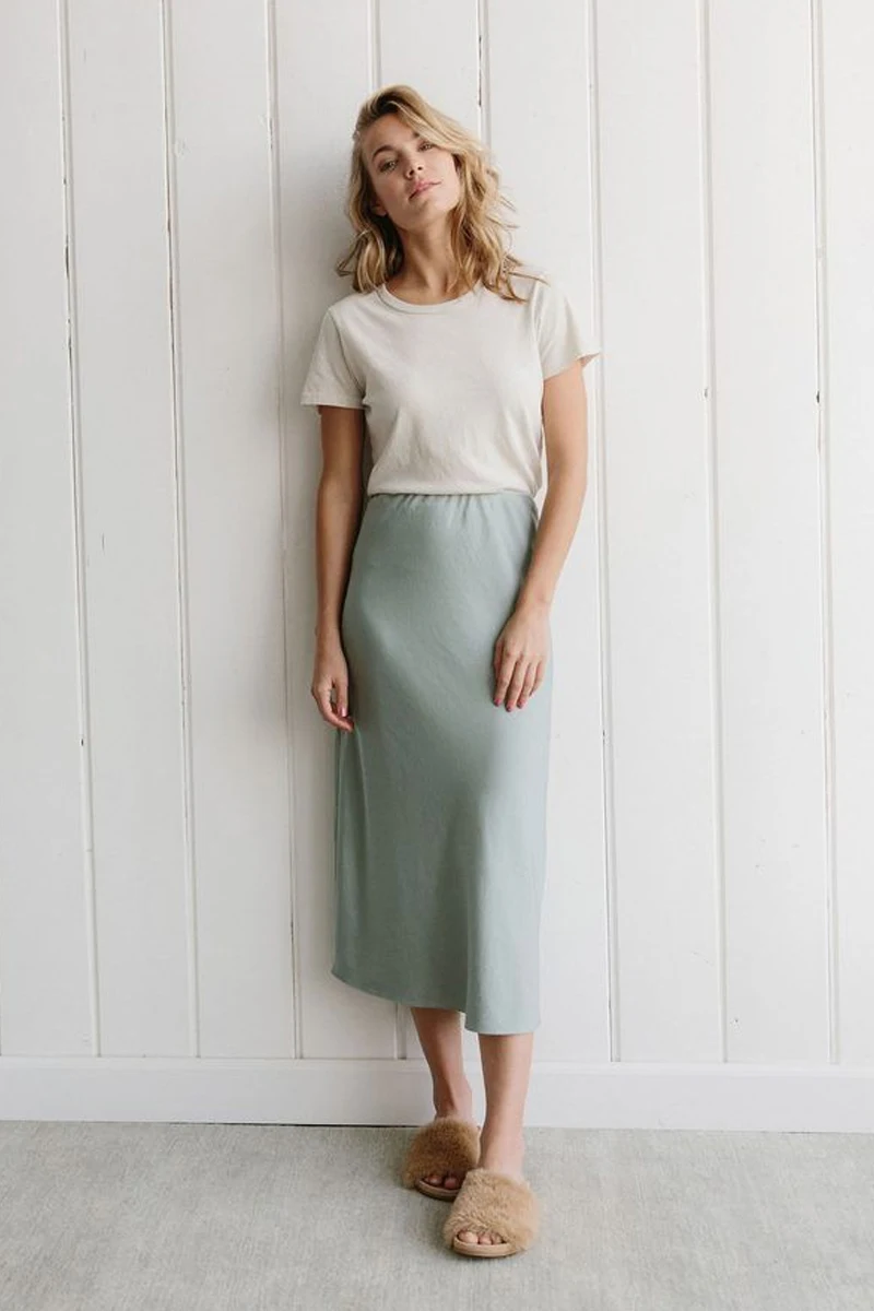 woman in a Beige Shirt and Below the Knee Skirt look