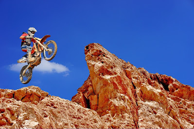 a biker with a bike in the air