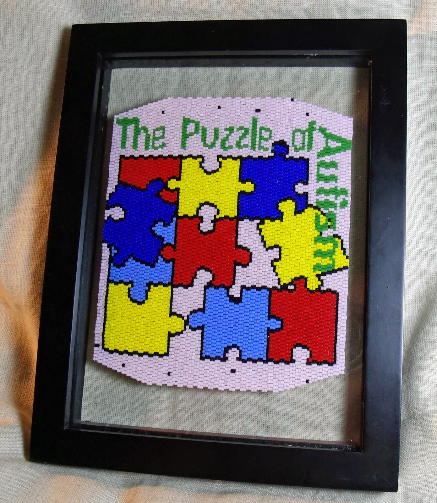 http://www.artfire.com/ext/shop/product_view/KraftyMax/4096681/The_Puzzle_of_Autism_Framed_Fully_Beadwoven_Artwork/Mixed_Media/Wall_Hangings