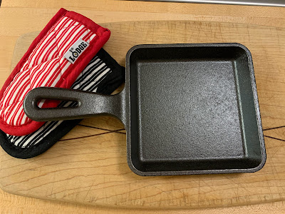 cast iron pan with hot pads