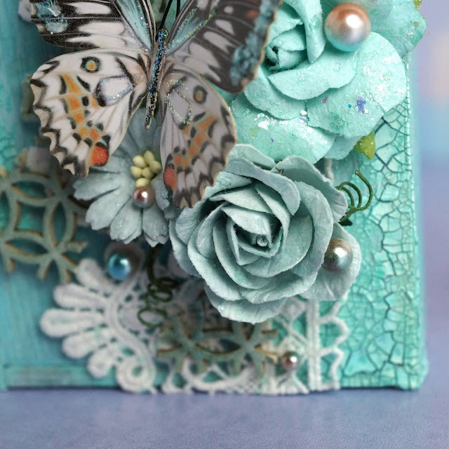 mixed media project made with Reneabouqets butterfly, chipboard, beautiful beads pearls, lace, paper flowers; Tim Holtz Distress Spray Stain salvaged patina and speckled egg, Distress Oxide Spray, Distress Glaze weathered wood; Scrapbook.com Pops of Color seafoam; Prima Marketing flower