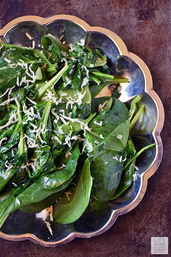 This Low Carb Spinach Breakfast Salad | by Life Tastes Good is a warm comforting way to start the day. Drizzled with Hot Bacon Dressing and topped with a perfectly fried egg, this salad tastes great in addition to being high in protein, and low in carbs. Did I mention it's quick and easy to make too! Winner! #LTGrecipes #SundaySupper