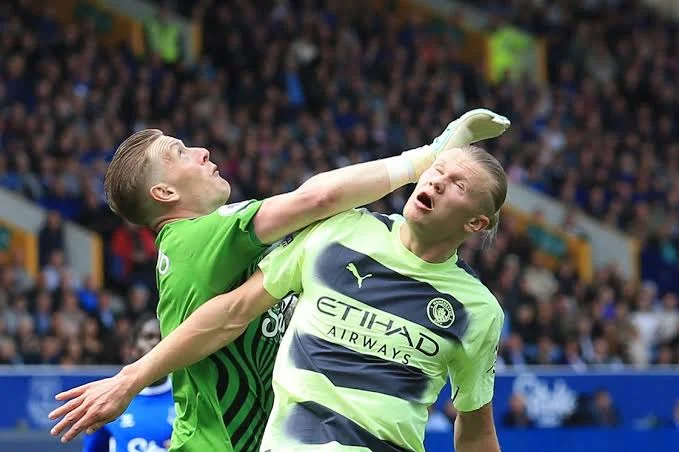 Controversy erupts as Jordan Pickford appears to 'punch' Erling Haaland in the head, but referee ignores