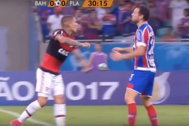 Bahia defender Lucas Fonseca theatrically falls to the ground despite not being touched by Paolo Guerrero