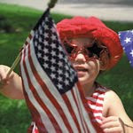 child waving flag