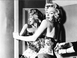 Marilyn Monroe tighten corset laced holding mirror