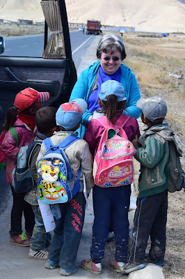 Handing-supplies-to-kids-near-Tingri-Tibet-2014-DSC_1752+(2)