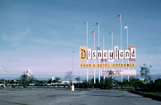 Disneyland entrance sign with Matterhorn in the background. (disneyland sign )