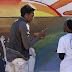 First Lady Michelle O. Helps Paint a Murel in Botswana...