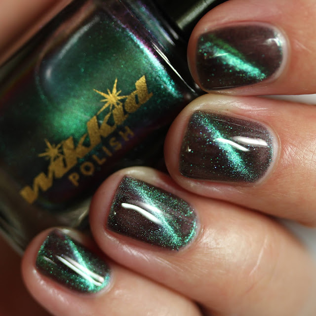 magnetic nail polish shifting from green and blue to purple