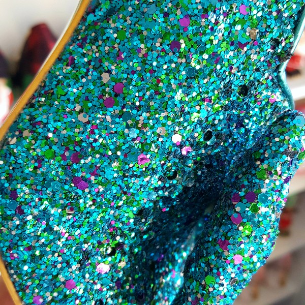 close up of purple and green glitter on uppers of Irregular Choice shoes