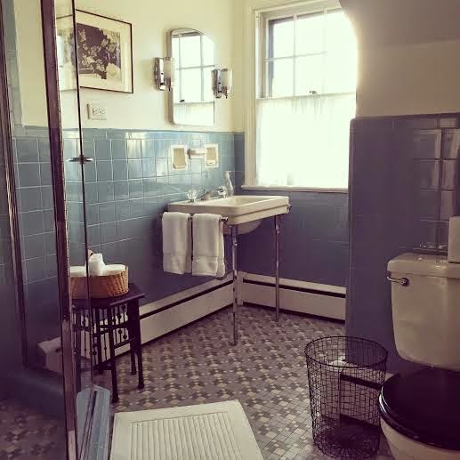 Vintage blue tile bathroom via Meet Me in Philadelphia