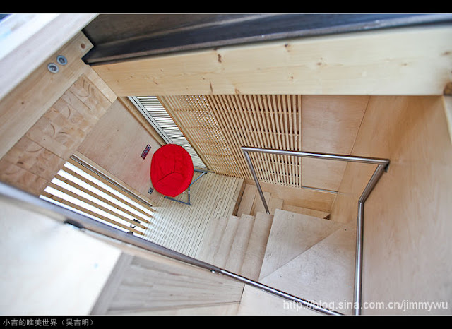 Photo of the wooden staircase inside of the sustainable micro house