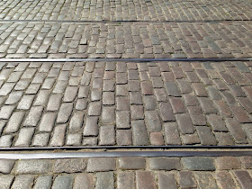 Tram Tracks and Cobblestones in Chlodna St. by Maja Trochimczyk