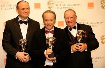 British directors (L-R) Bob Parker, Nick Park and Steve Pegram pose with the award for Short Animation