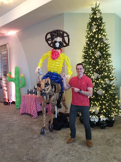 The Utah Balloon Artist with a life size sculpture of a cowboy riding a horse