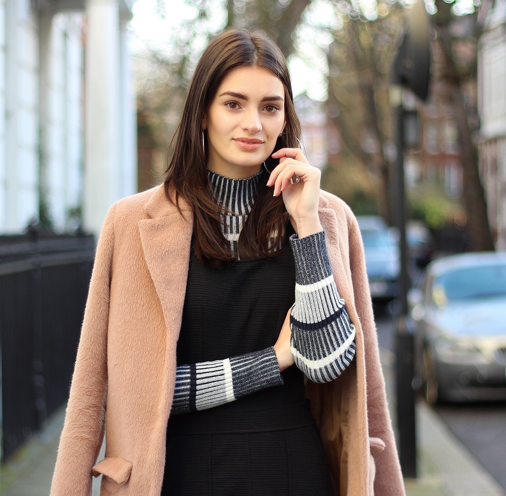 salmon pink coat and striped roll neck jumper