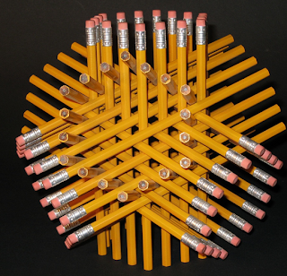This is a picture of a bunch of pencils stacked on top of each other.