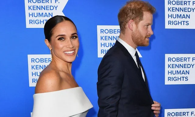 The Duchess wore a custom white gown by Nicolas Ghesquiere for Louis Vuitton. Meghan Markle is wearing Diana’s aquamarine ring