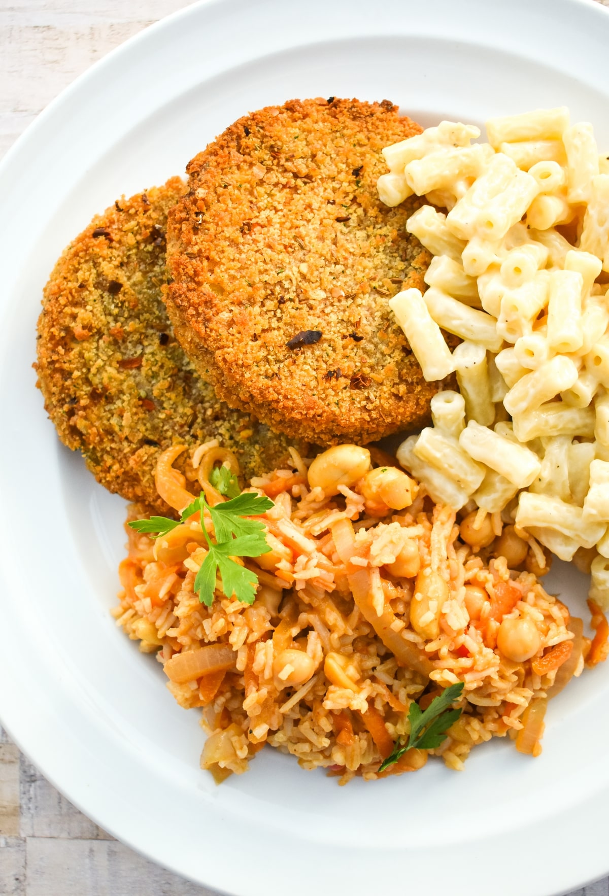 Dirty rice served with spicy bean burgers & mac and cheese