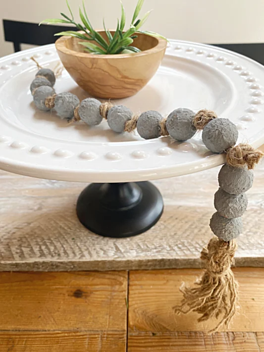 cement beads on a pedestal dish