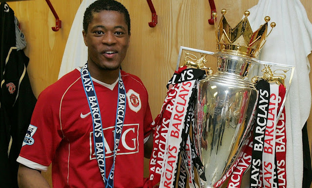 Patrice Evra holds UEFA Champions League Trophy